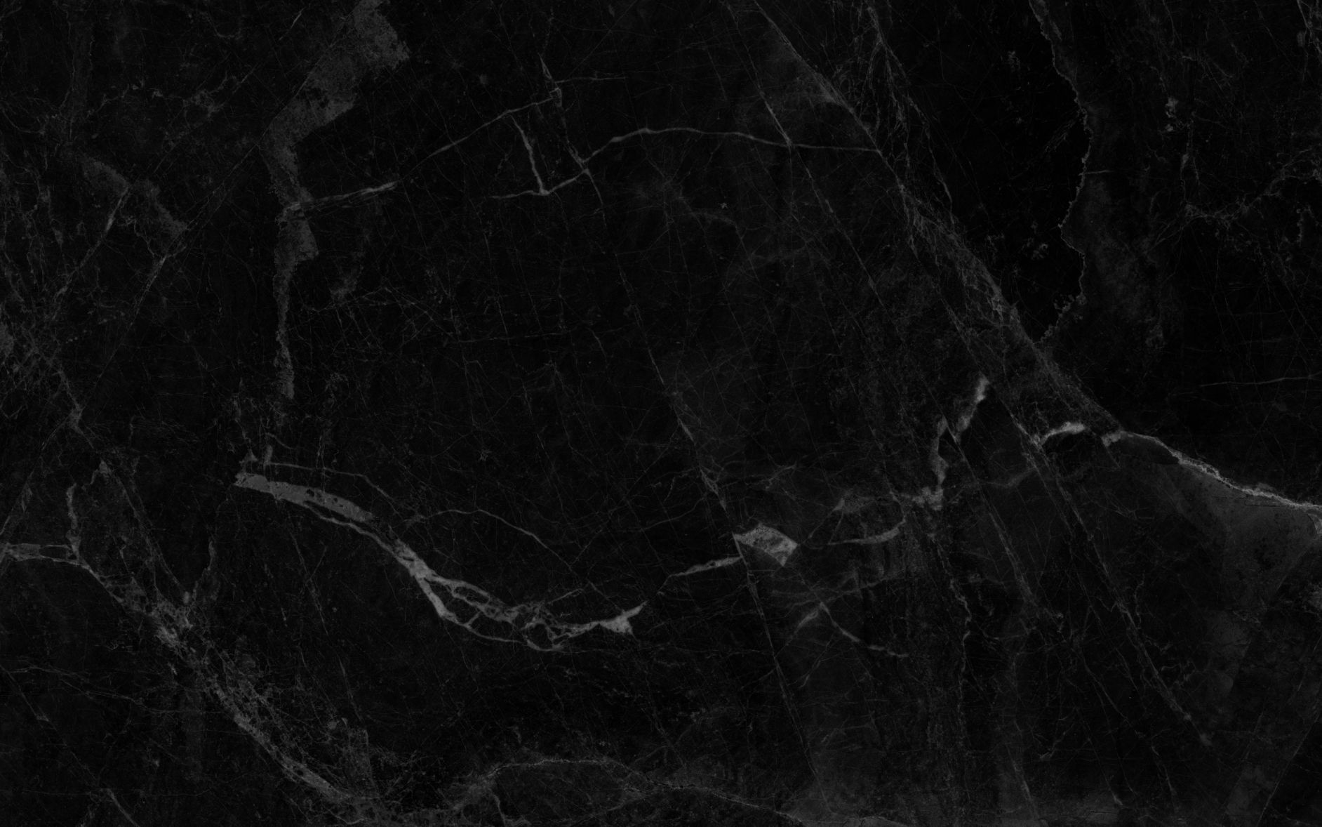 Black marble texture with white veining.