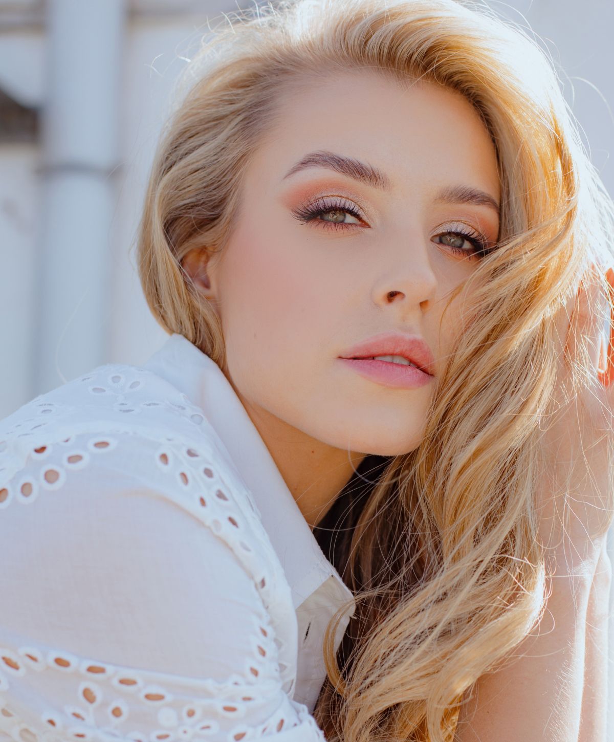 Woman with long hair and natural makeup.