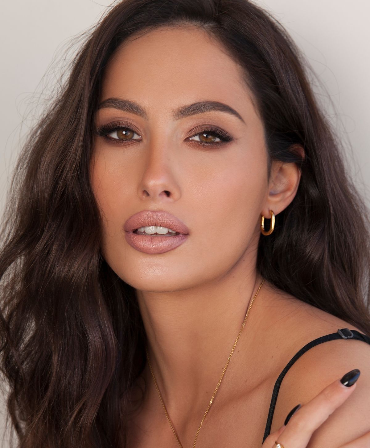 Close-up portrait of a woman with elegant makeup.