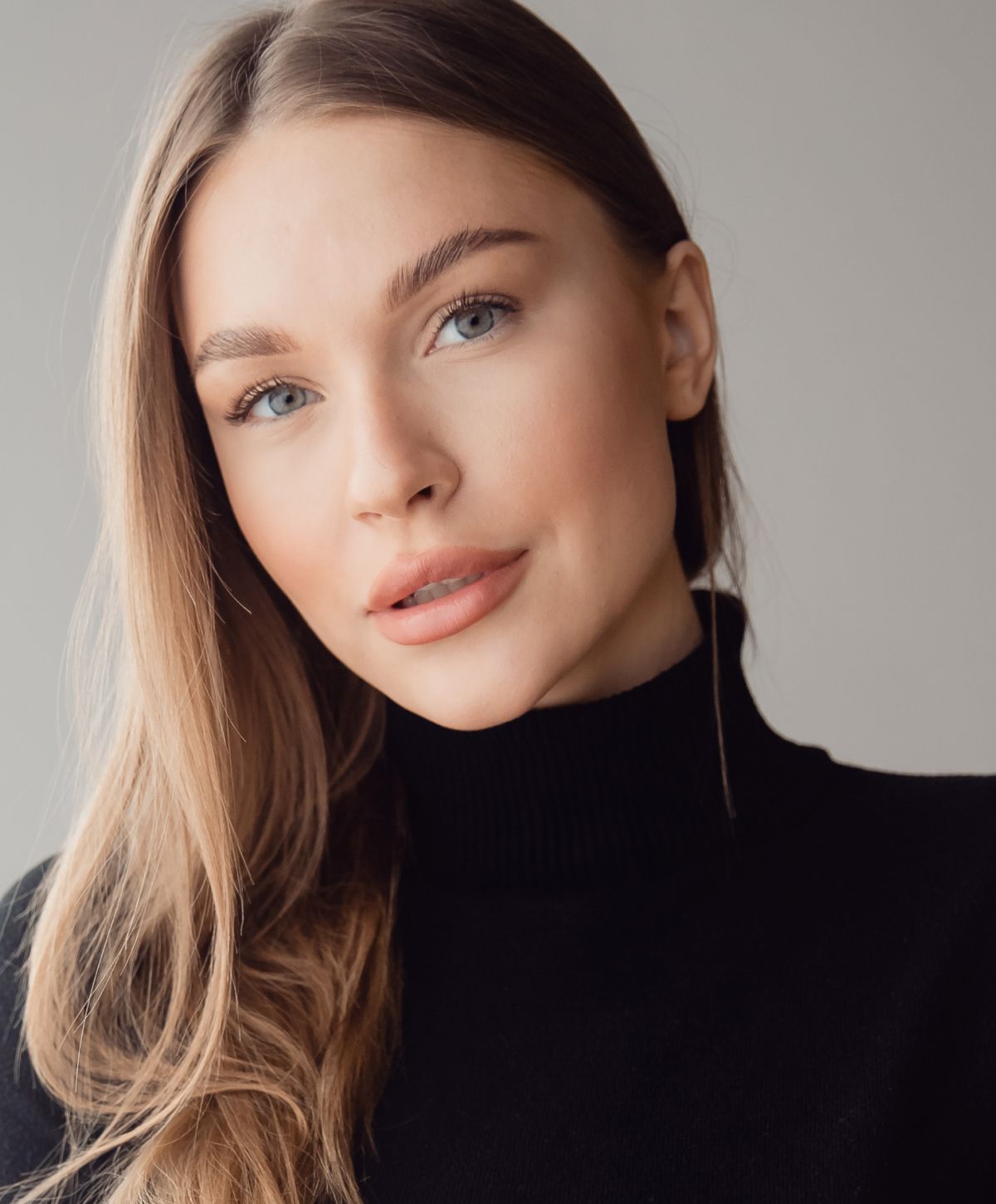 Portrait of a woman with long hair.