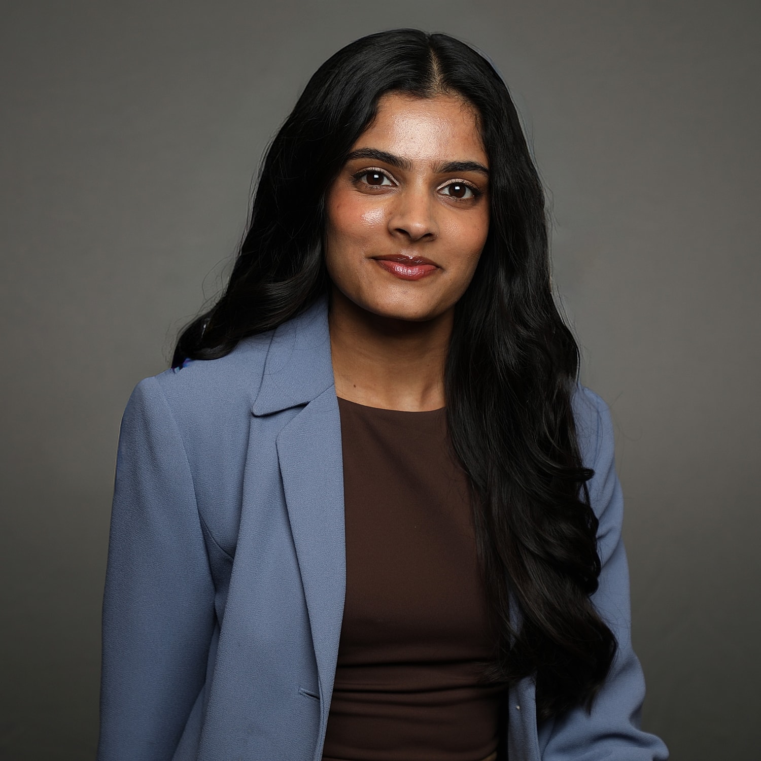 Professional portrait of a woman in a blazer.