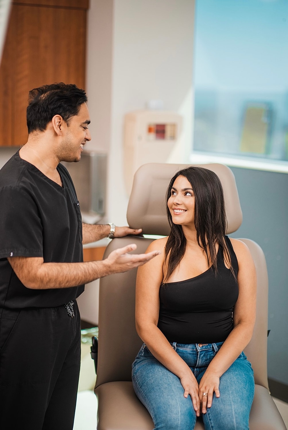 Elk Grove Village med spa patient consulting with Dr. Kapadia before injection treatment.